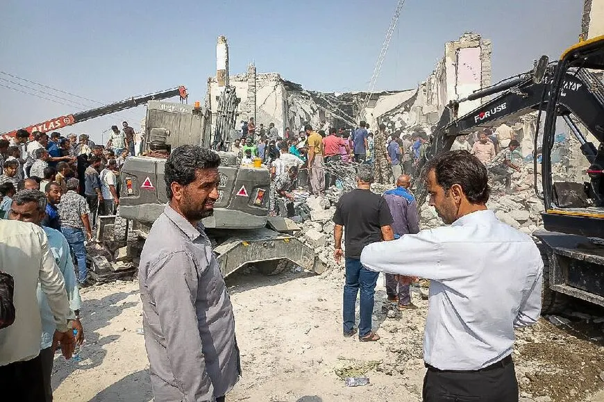 Officials in Iran asses the damage from the US strike on a school — Image from al-monitor.com